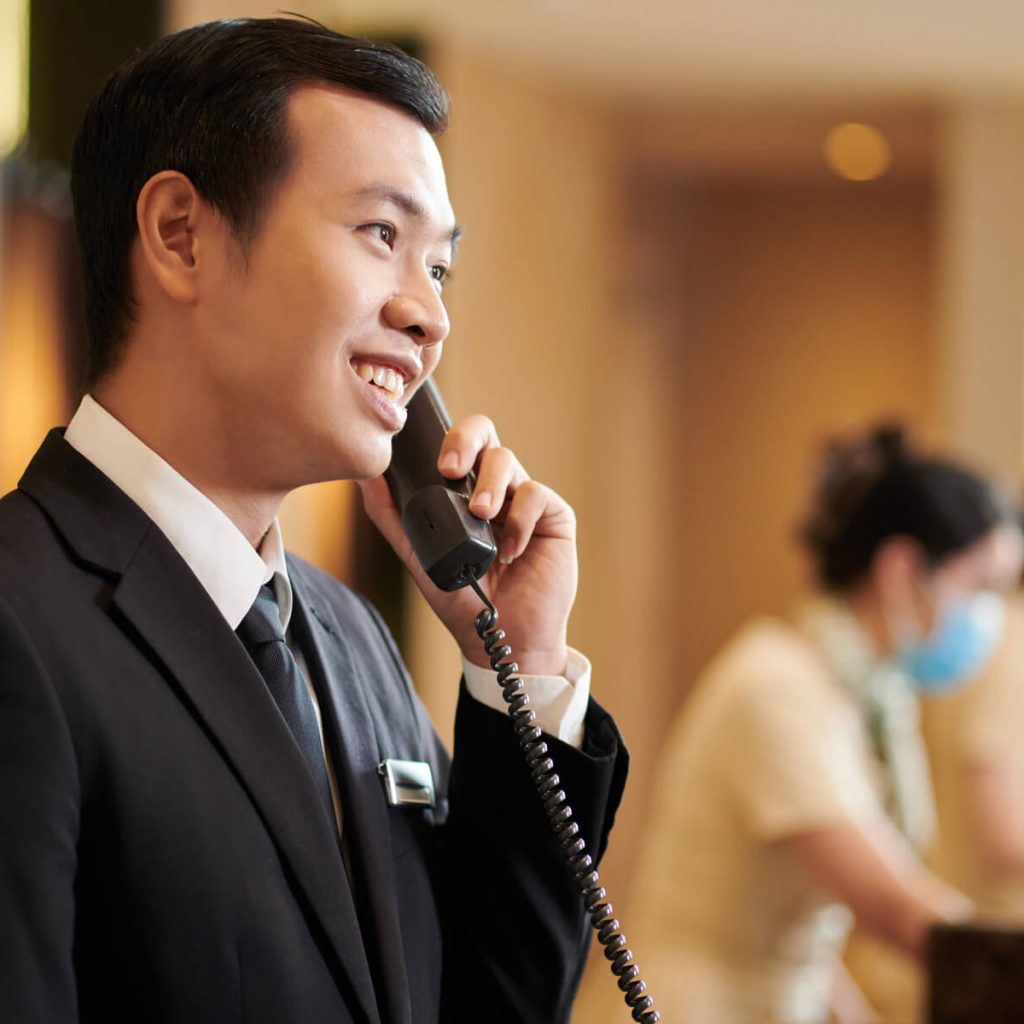 hotel-manager-answering-call-from-guest-2023-11-27-05-35-24-utc-1-1.jpg